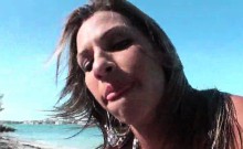 Busty wife takes it hard from the back on public beach