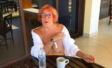 Amateur redhead Jacqueline with glasses masturbates