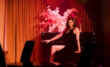 Sexy Maitland Ward posing on the piano